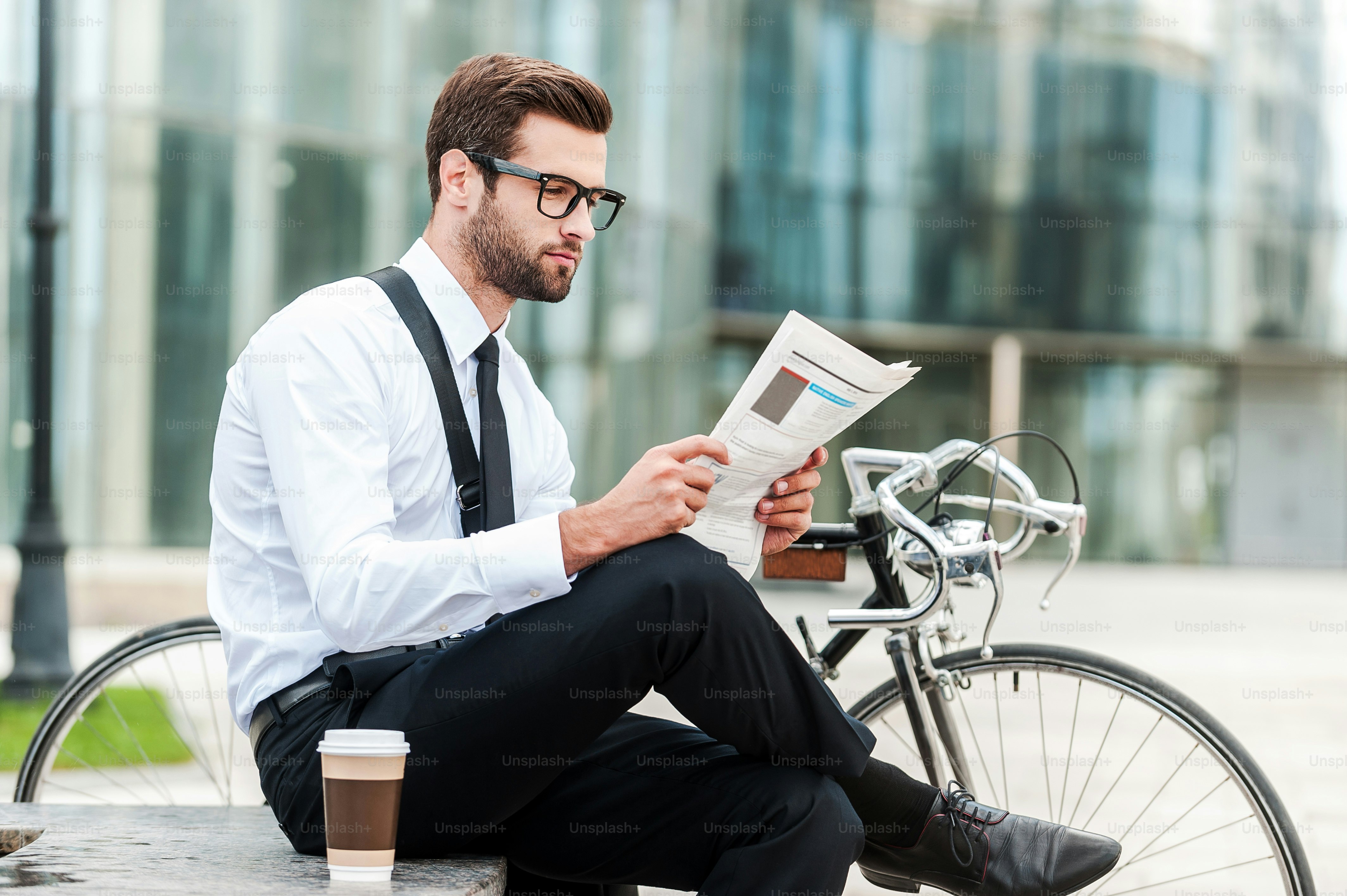 Low angle view of confident young businessman keeping arms crossed and ...