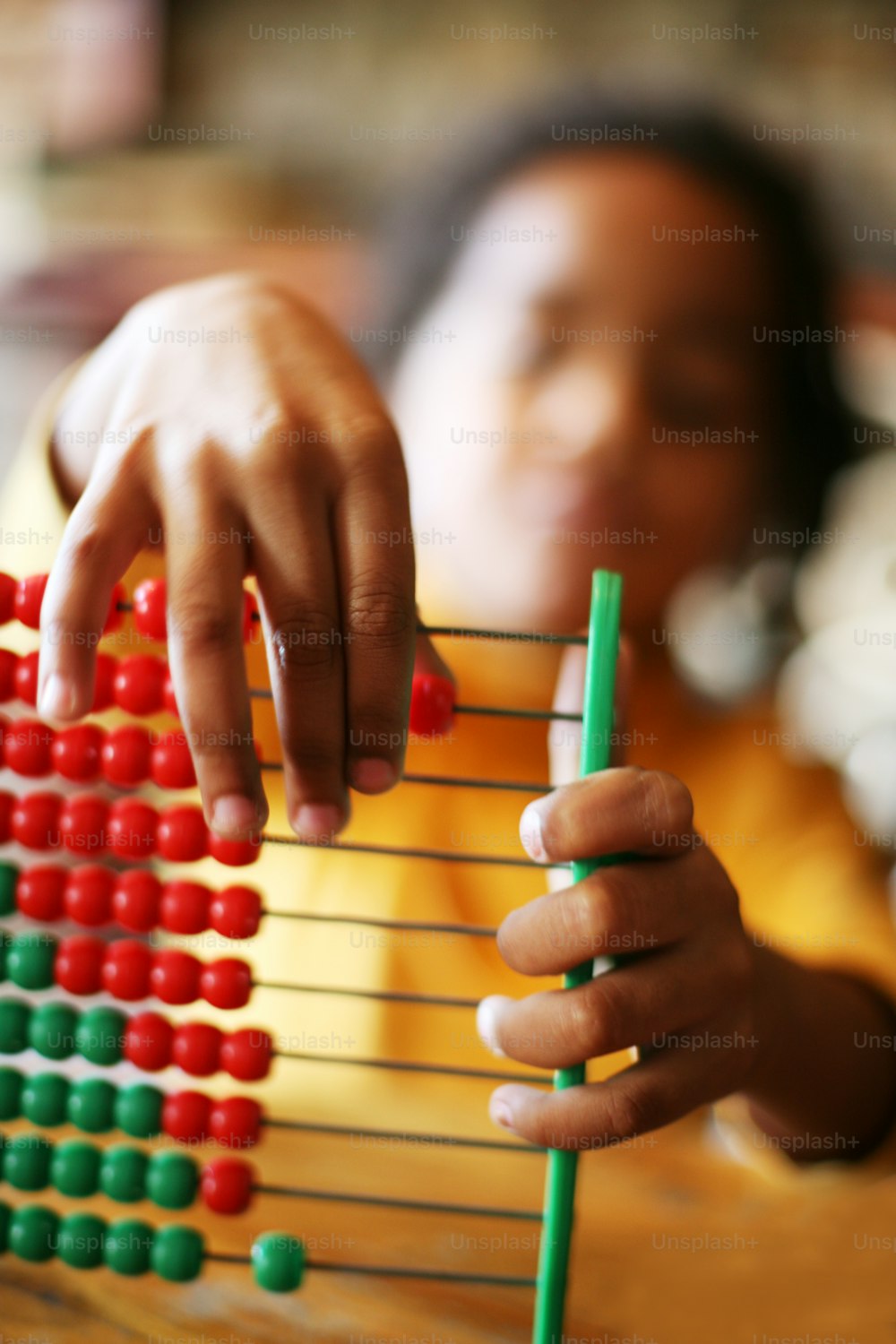 Close up of little girl ands accounting.