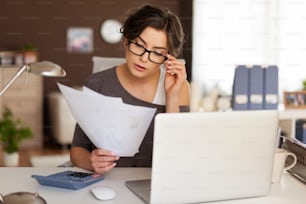 Young woman hard working at home 