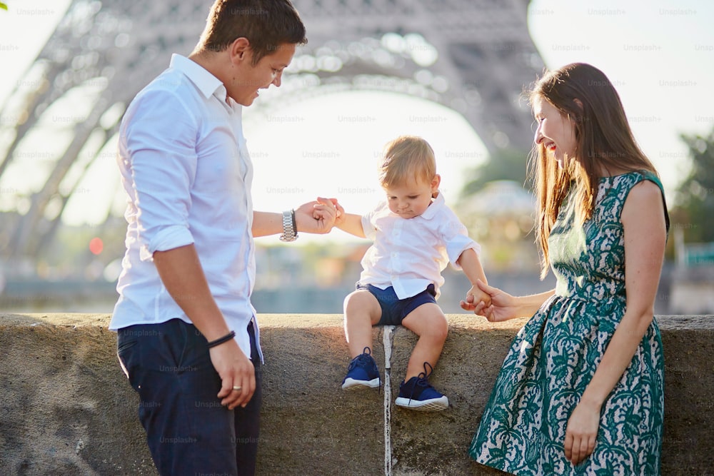 Happy family of three enjoying their vacation in Paris, France