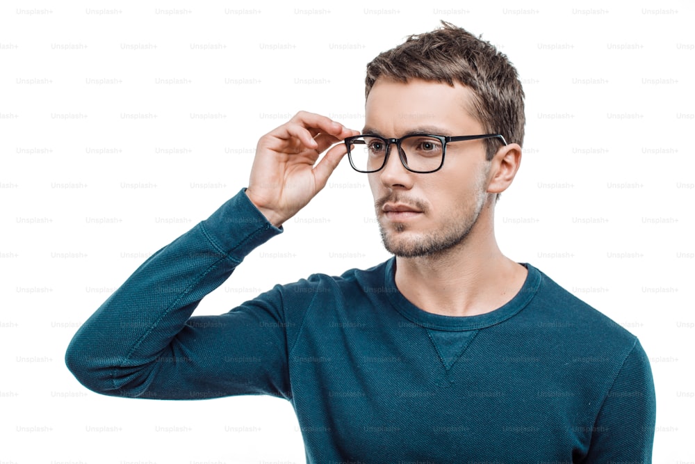 Portrait of stylish handsome young man isolated on white background. Man wearing glasses