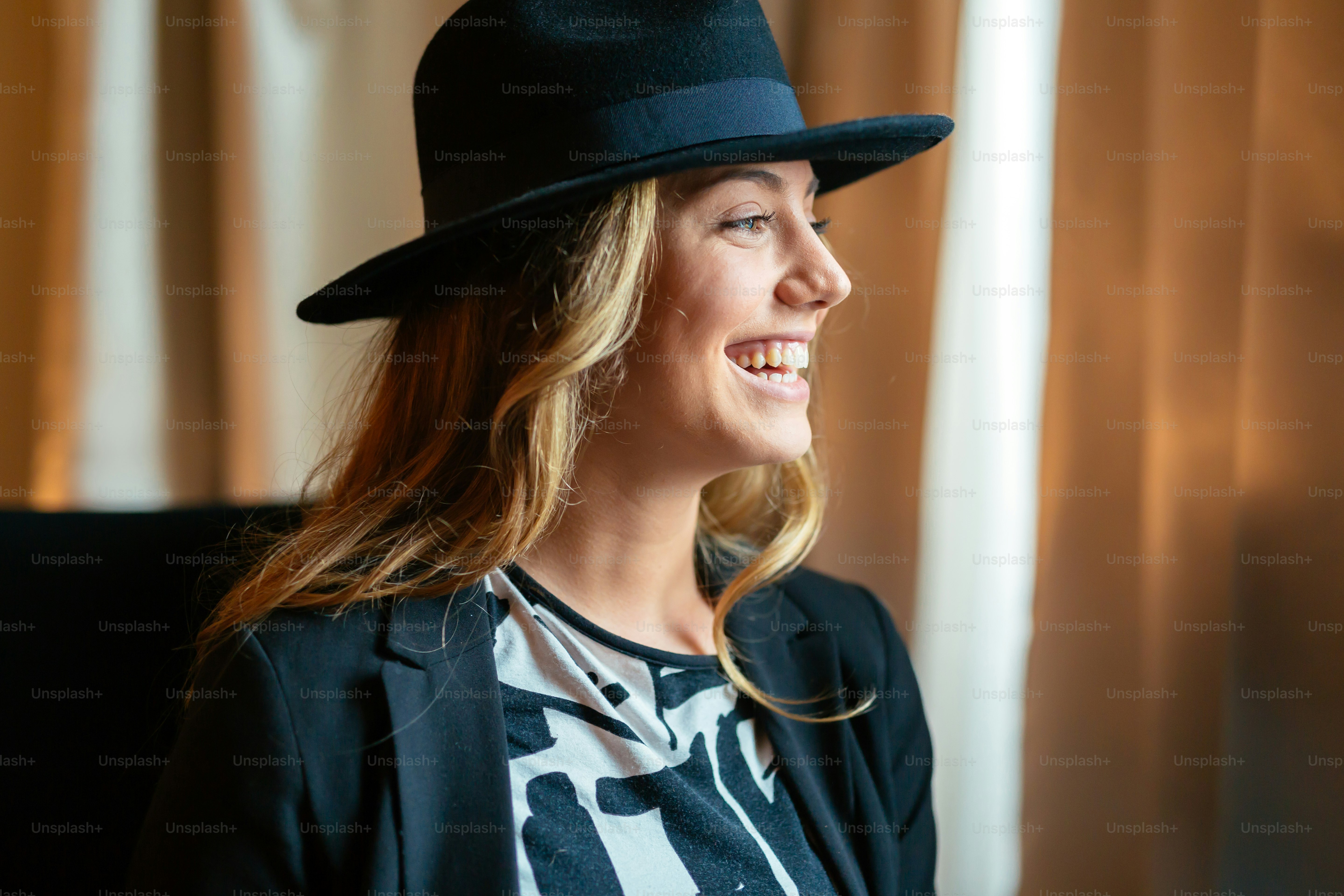 Glamorous happy  woman  staring through window