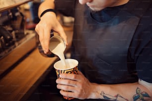 Barista at work in a coffee shop. Preparation service concept