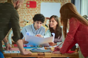 Group of Architects/Designers working in modern start up office