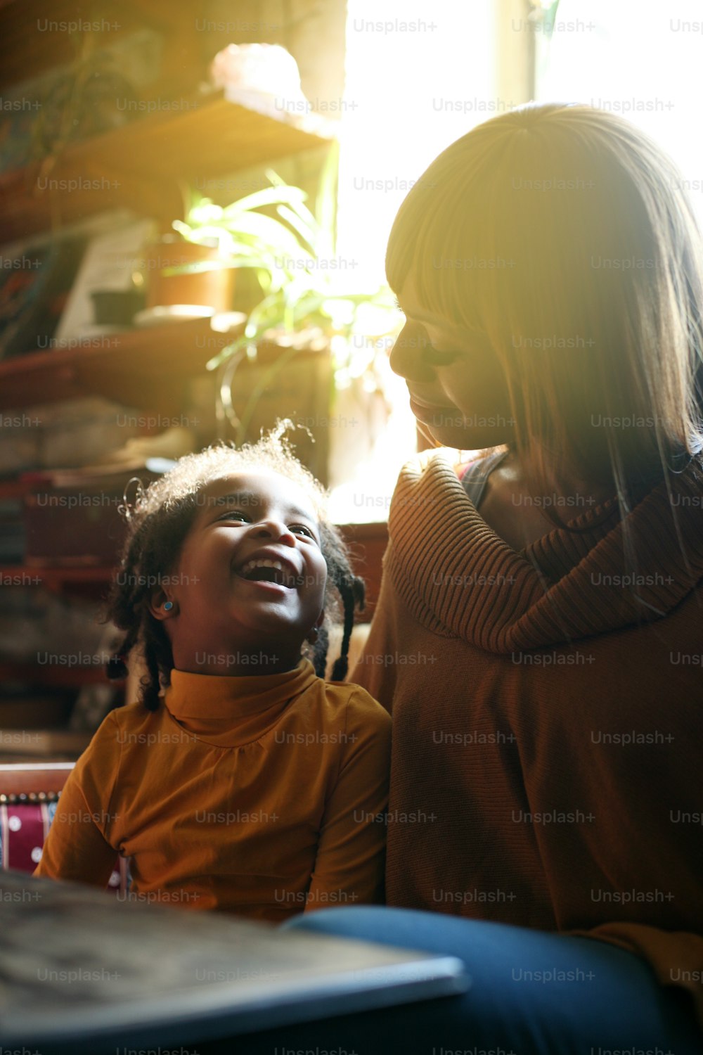 African American mother and daughter having fun at home.