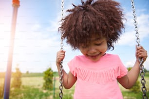 She loves swinging at the playground