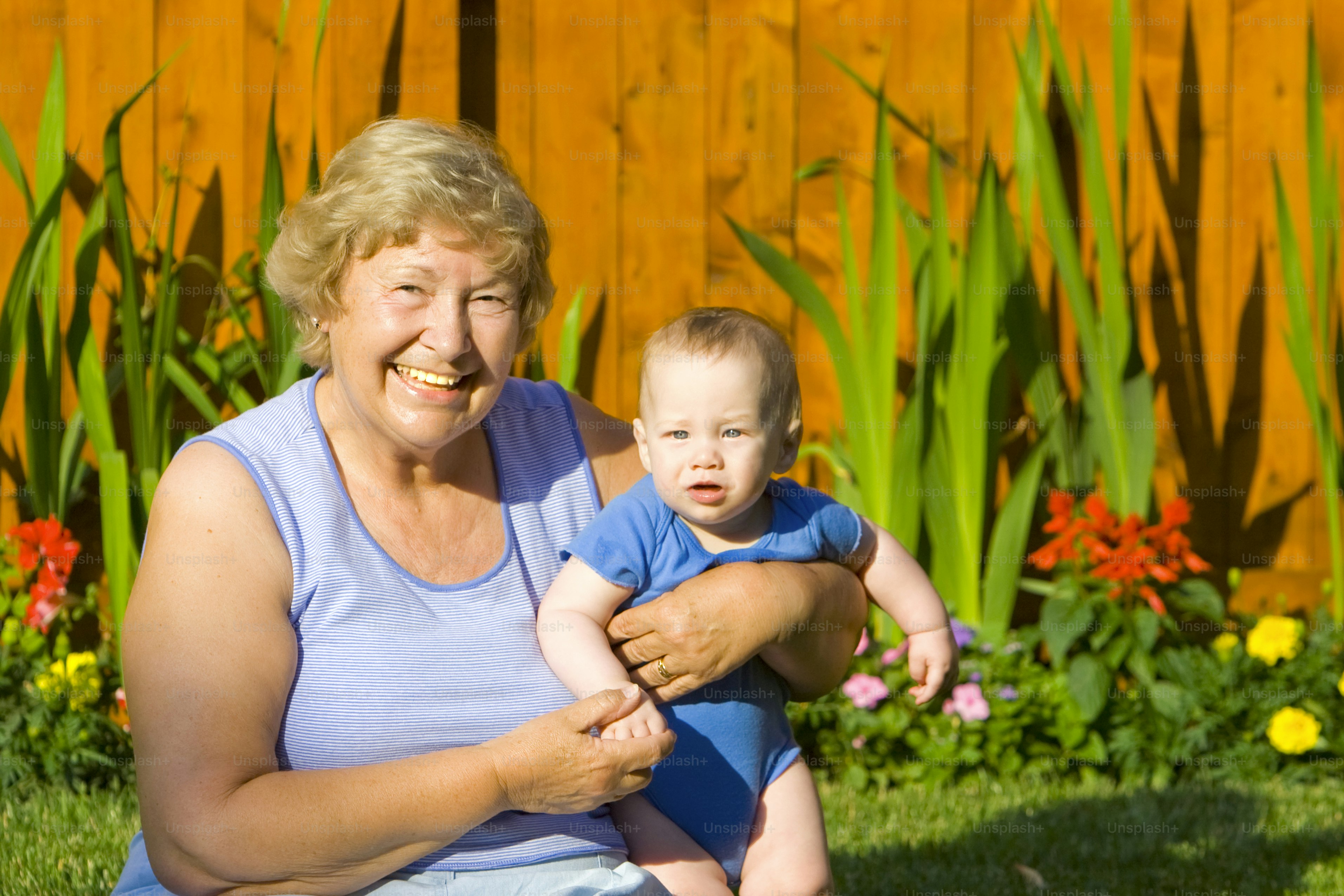 a woman holding a baby in her lap