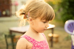 Backlit portrait of beautiful little girl.