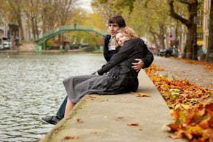 Dating couple in Paris on canal Saint-Martin