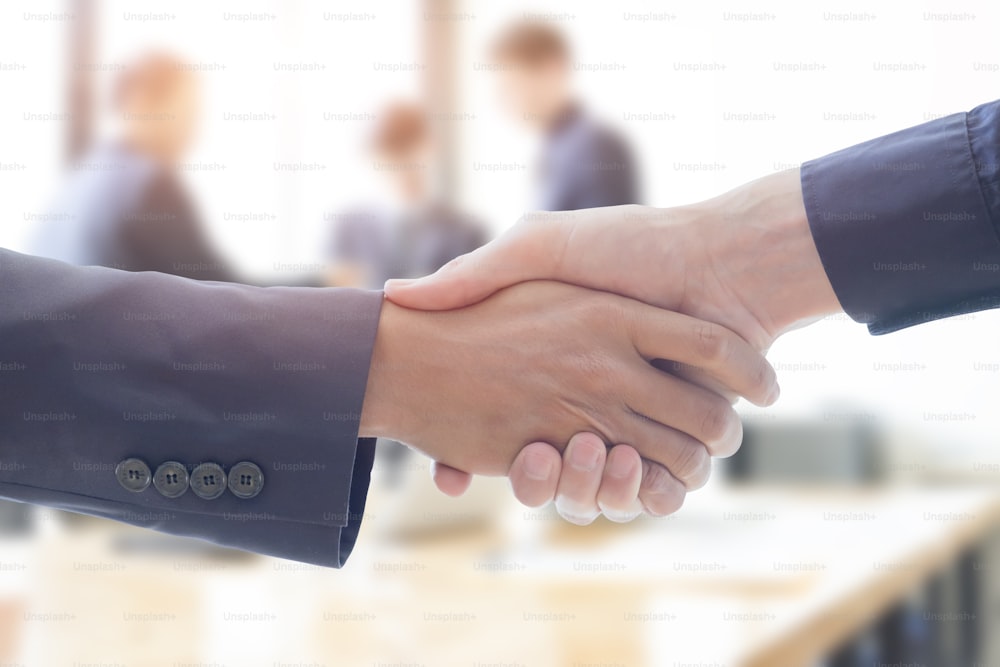 Businessmen handshake and business people ; success, dealing, greeting & business partner concepts - vintage tone,Retro filter effect.