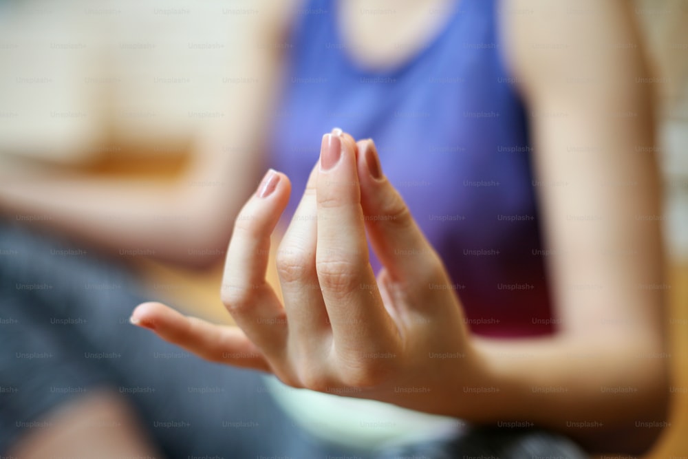 Woman meditating in the Lotus pose (Padma Sana).