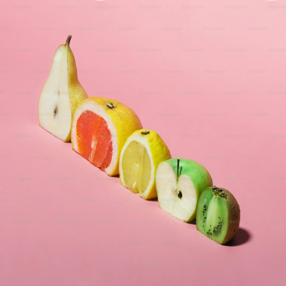 Various fruits sliced in half. Minimal concpet.