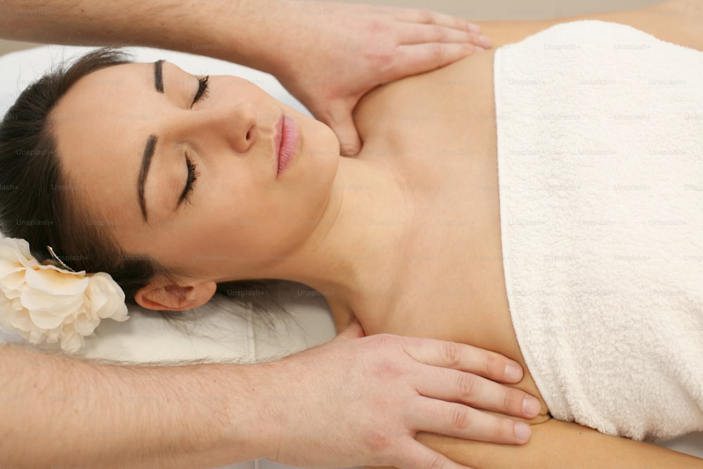 Young woman enjoying a massage treatment.