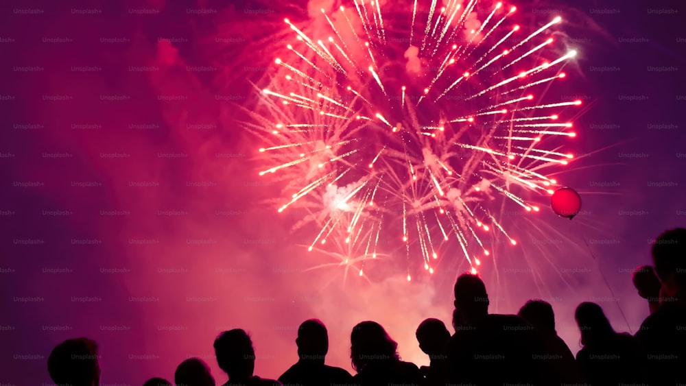 Crowd wathcing fireworks and celebrating