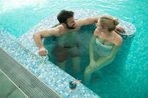 Couple enjoying bubble bath and hydrotherapy