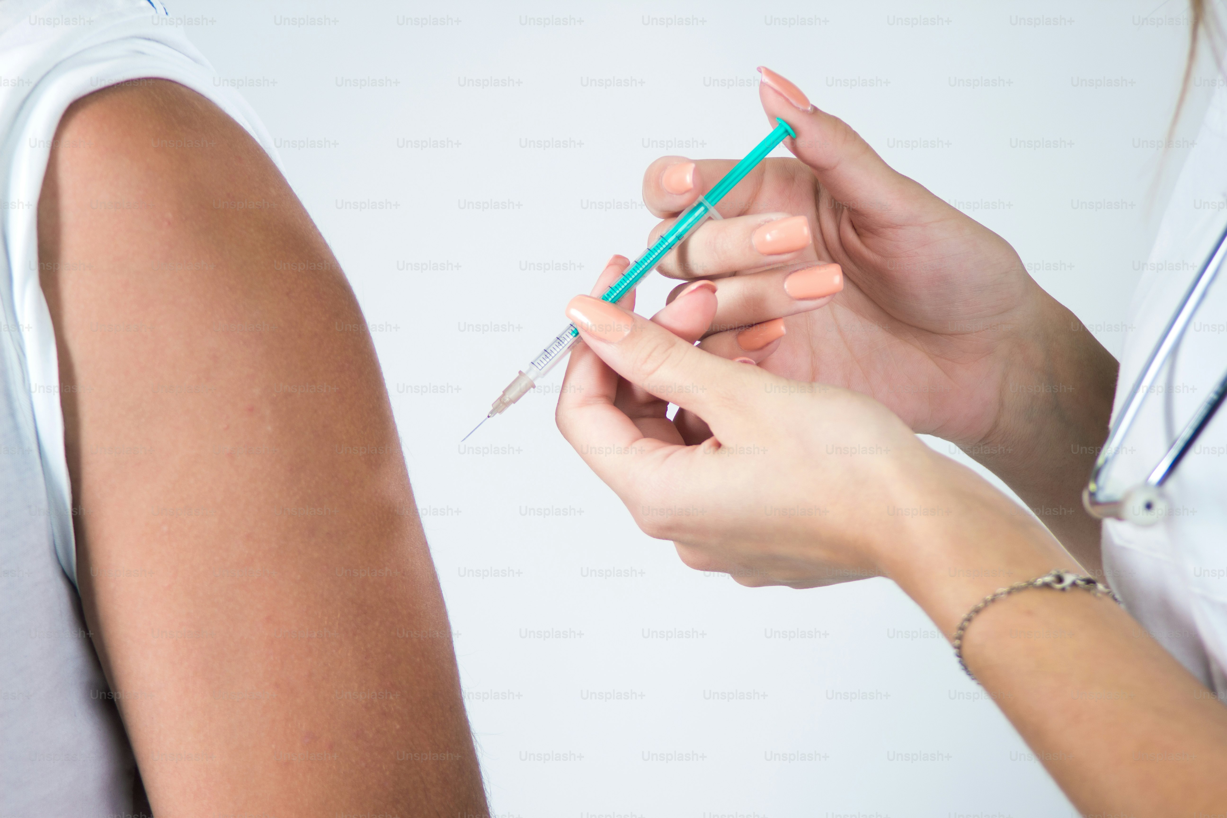Vaccination, boy receives a vaccination in the doctors office
