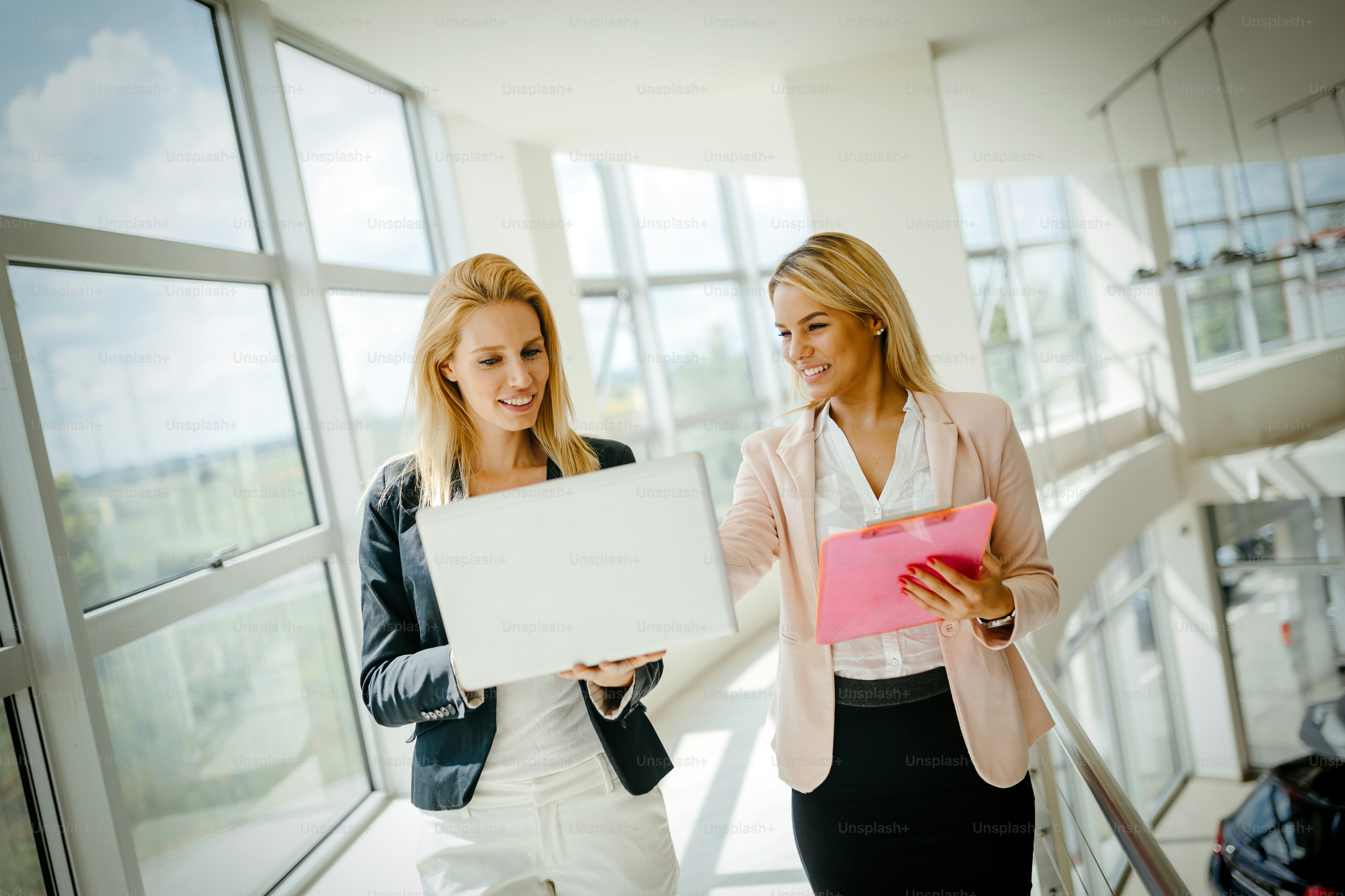 Business women colleagues at work talking