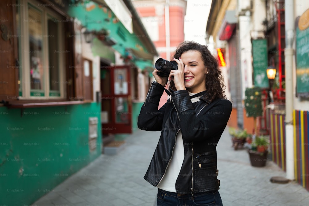 Woman traveling and taking pictures outdoors
