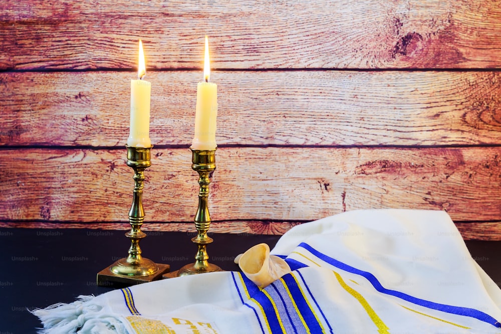 Jewish holiday Sabbath image. challah bread and candelas on wooden table