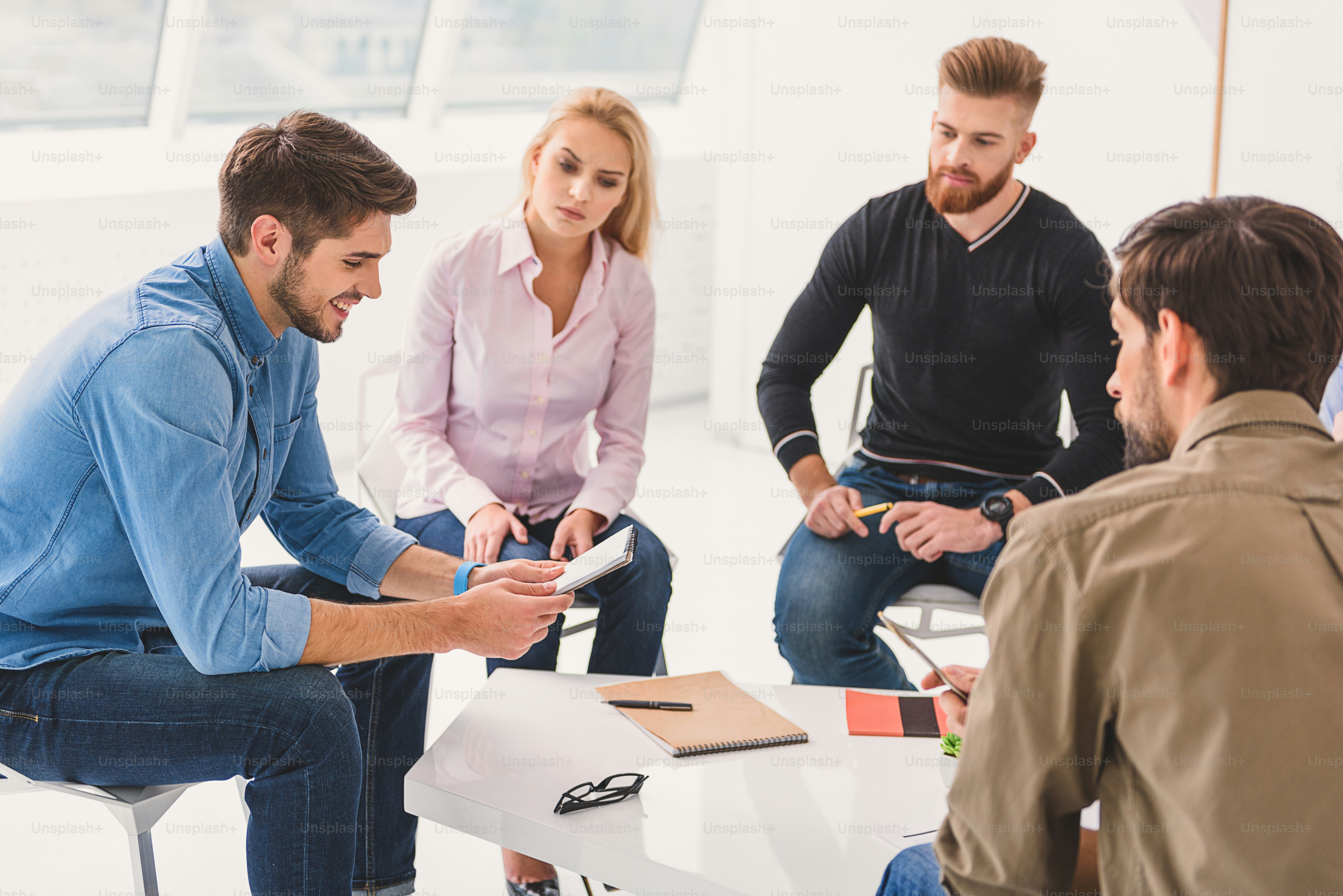 Introduce yourself. Amiable psychotherapist is asking people for ...