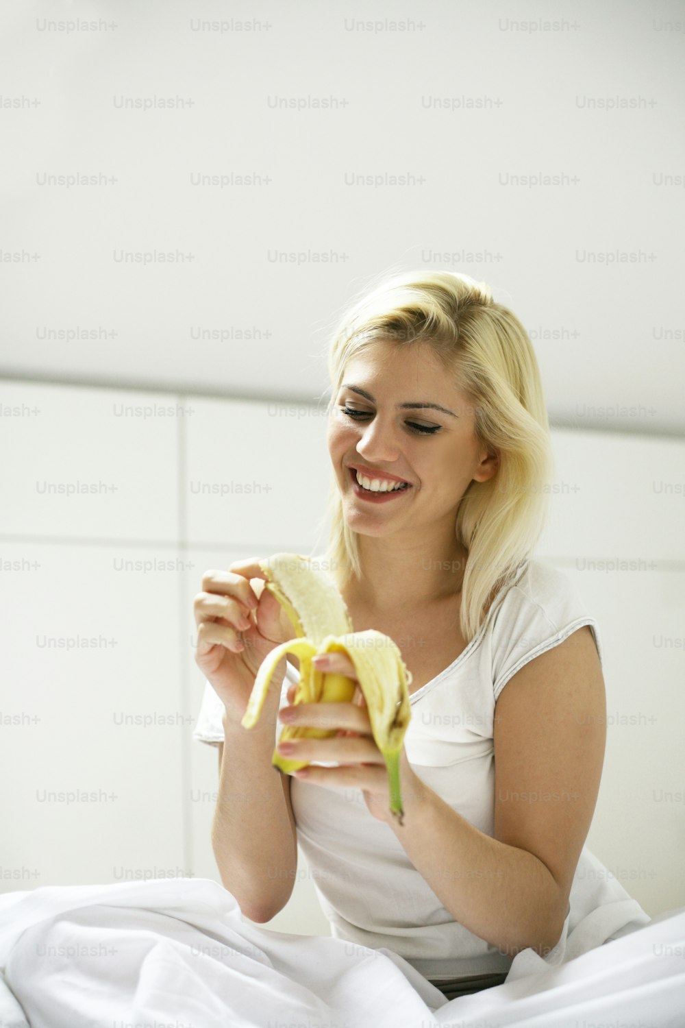Young beautify woman eats  healthy breakfast. Place for copy.