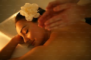 Woman during a massage treatment in spa.