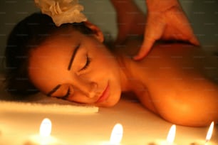 Woman during a massage treatment in spa.