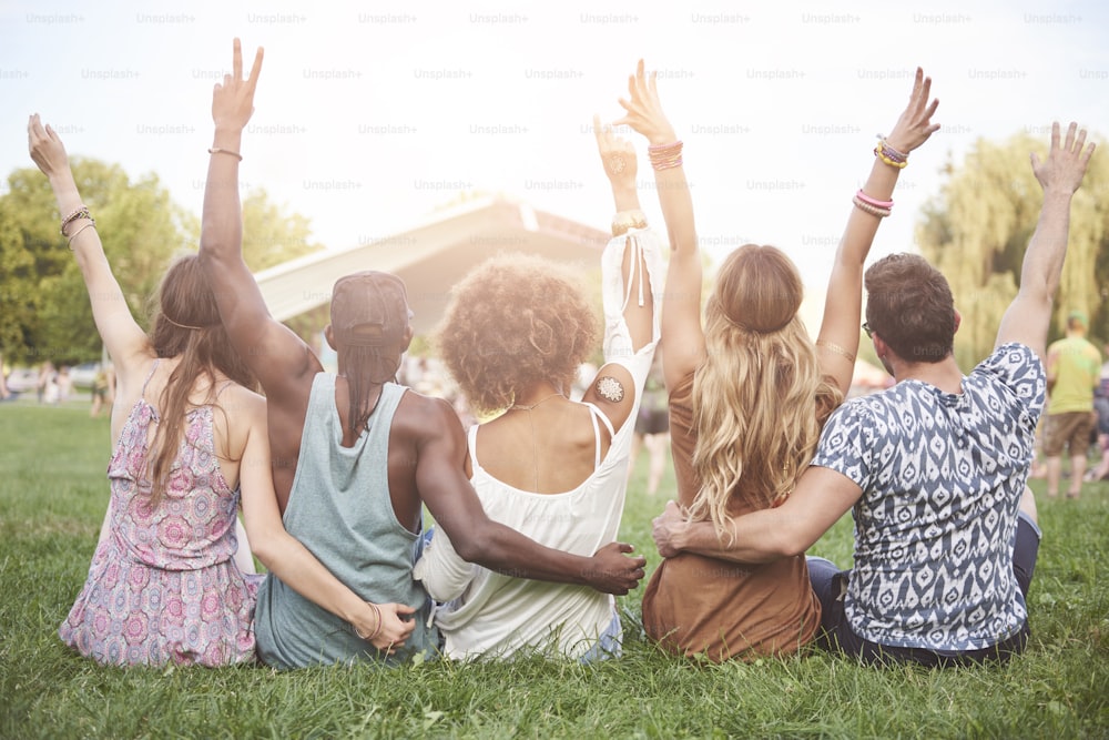 Young people cheering and chilling outside