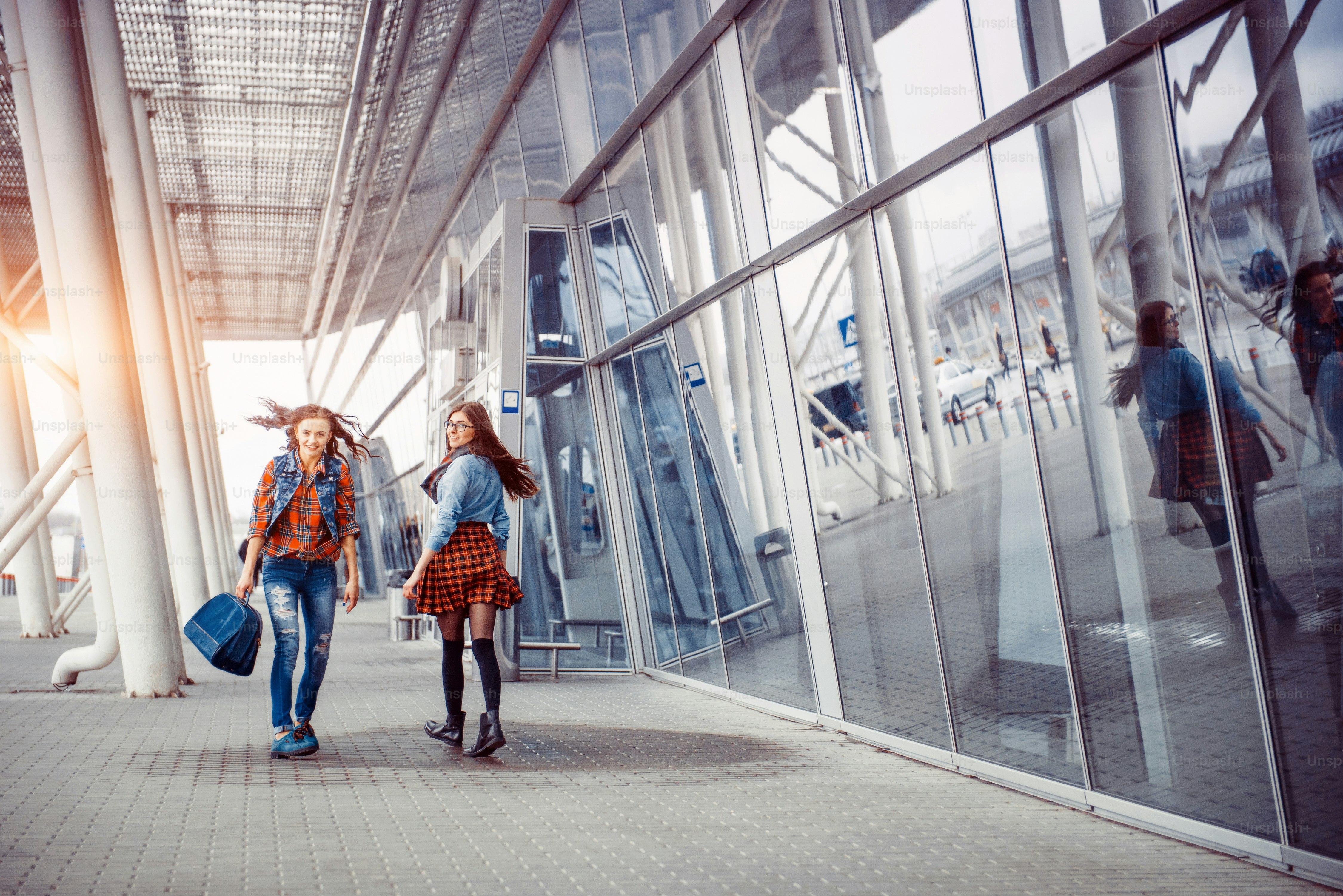 Girls having fun and happy when they met at the airport.Art processing and retouching photos special.