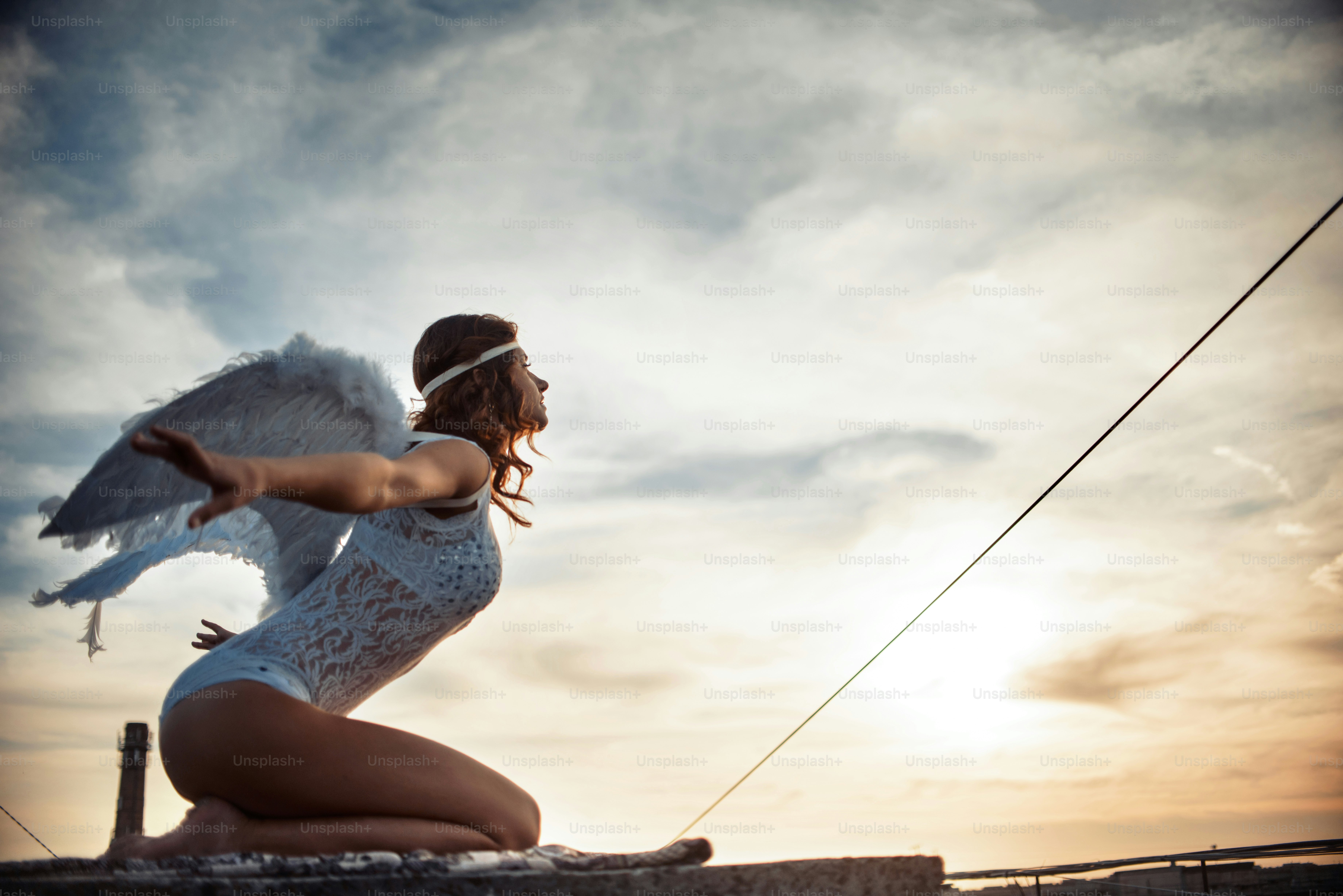 Sweet angel girl, fallen on the roof, art photo