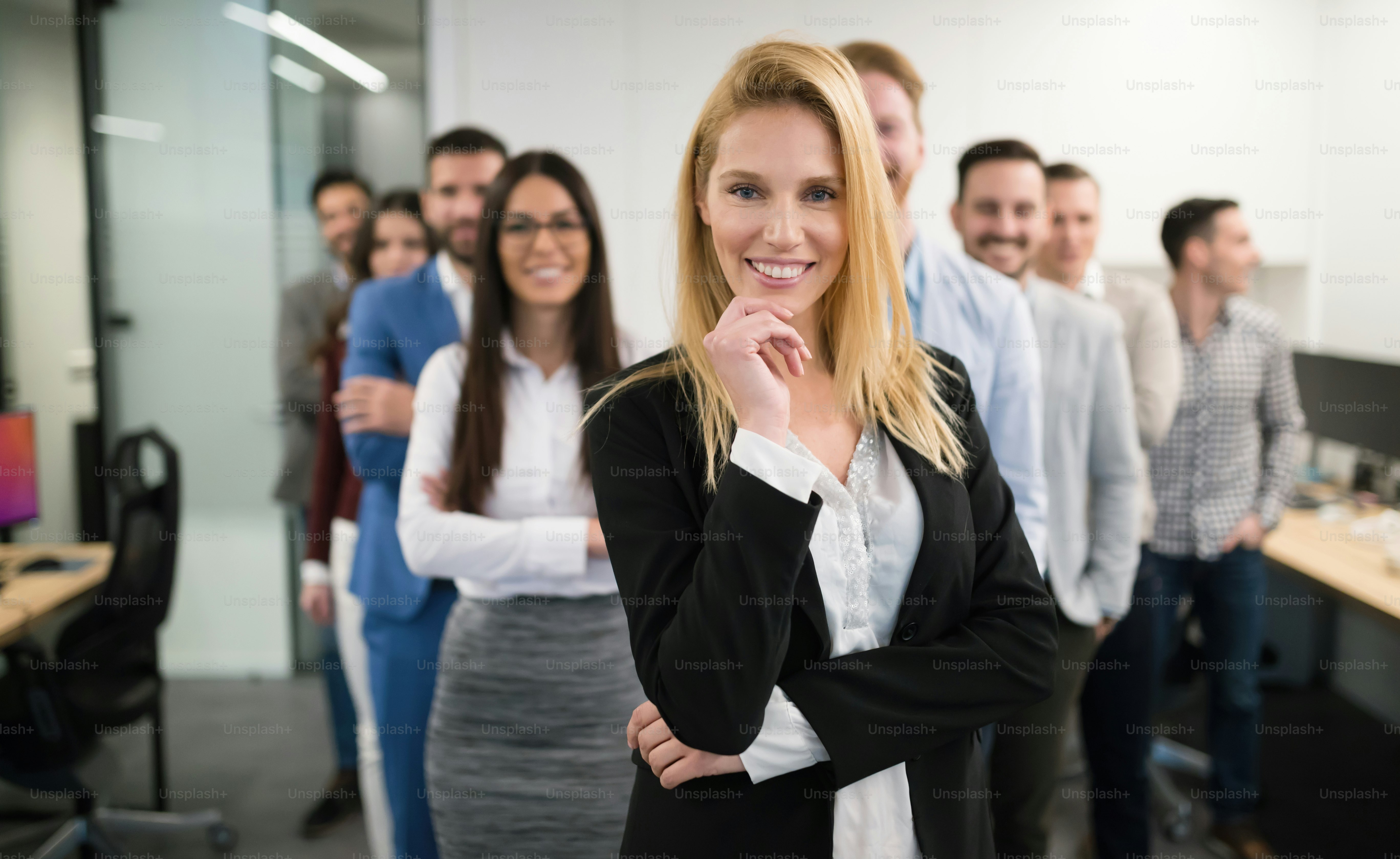 Group of happy business people and company staff