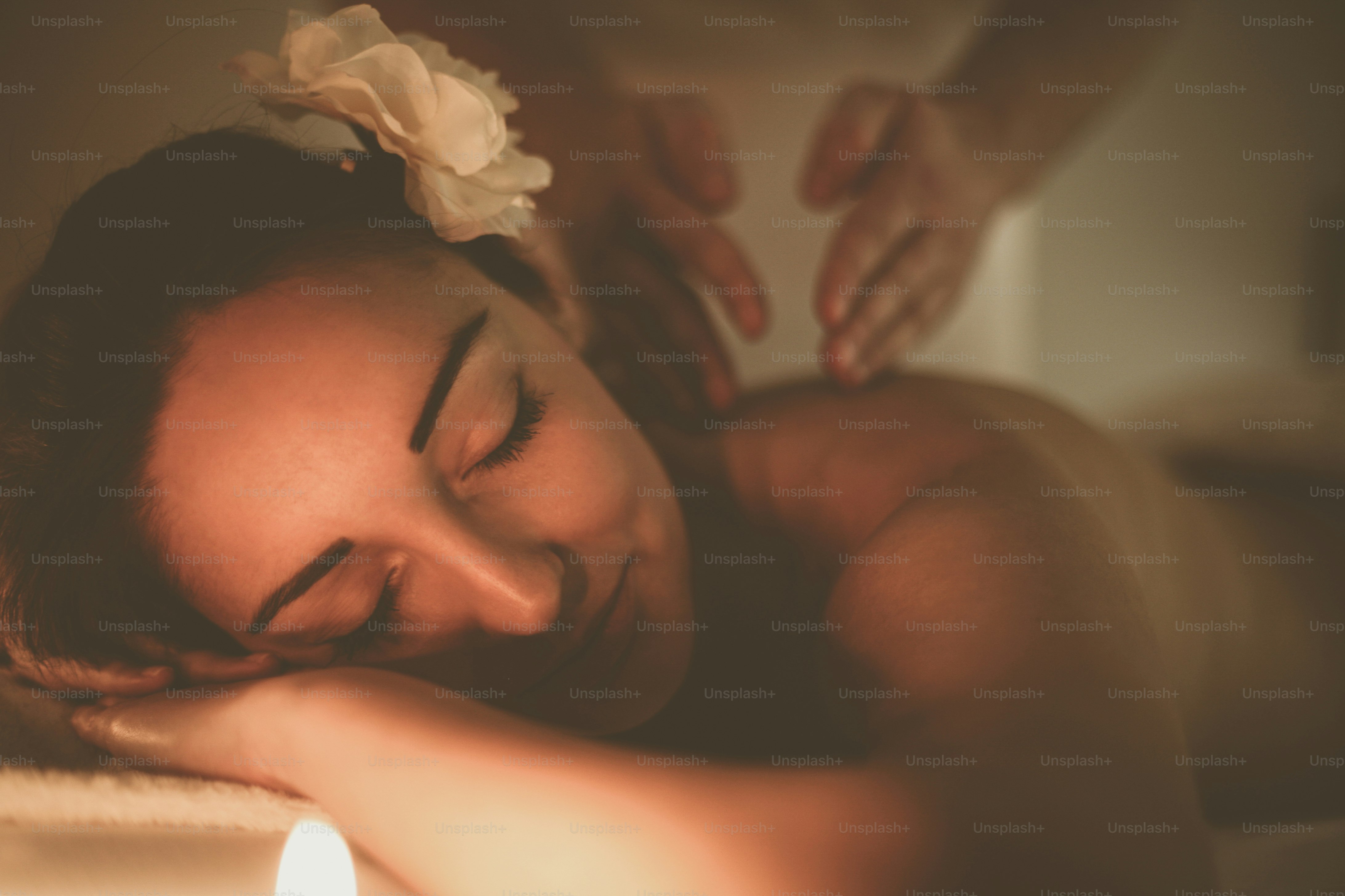 Woman during a massage treatment in spa.