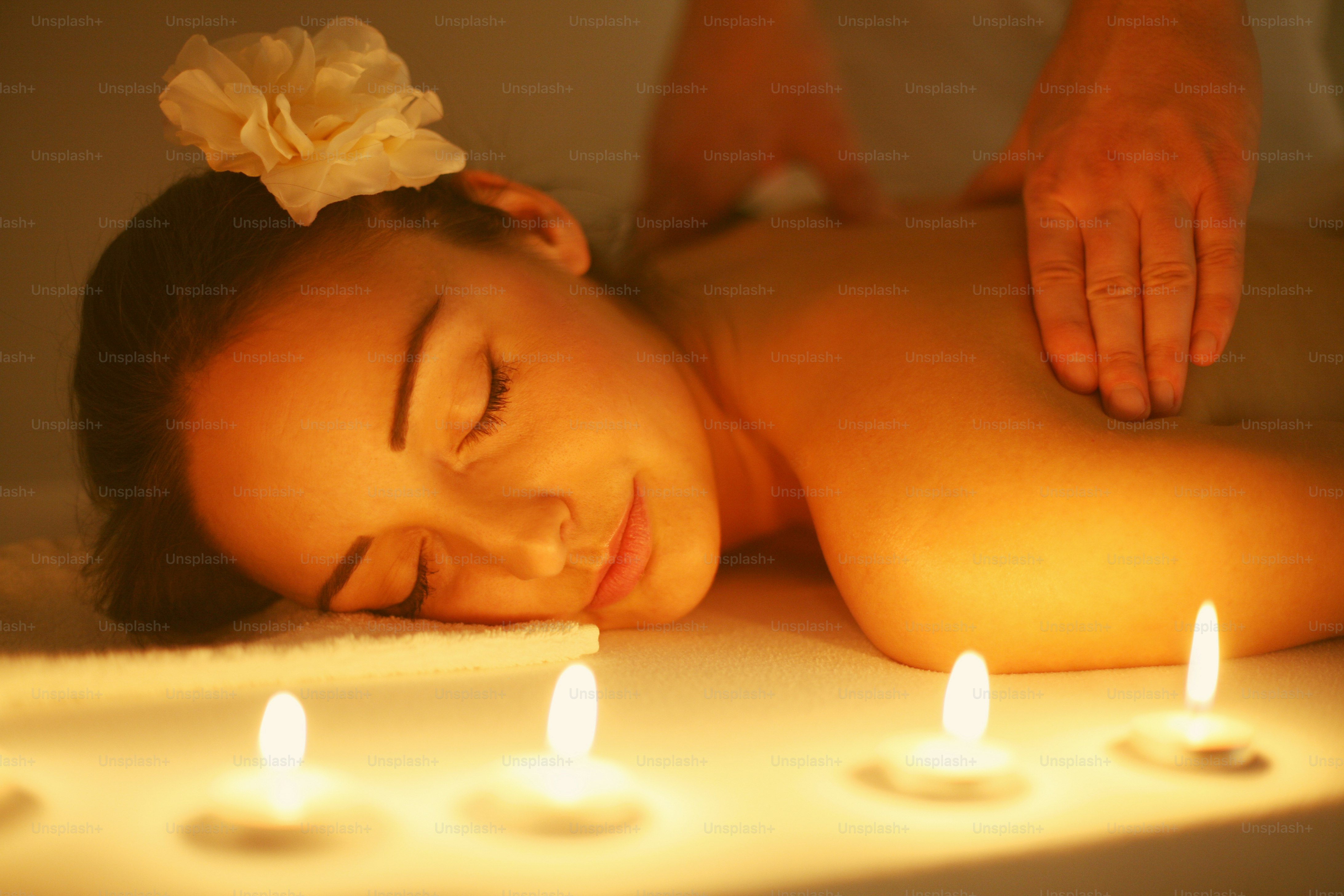 Woman during a massage treatment in spa.