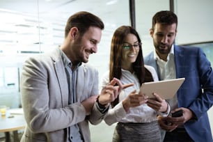 Business people having fun and chatting at workplace office