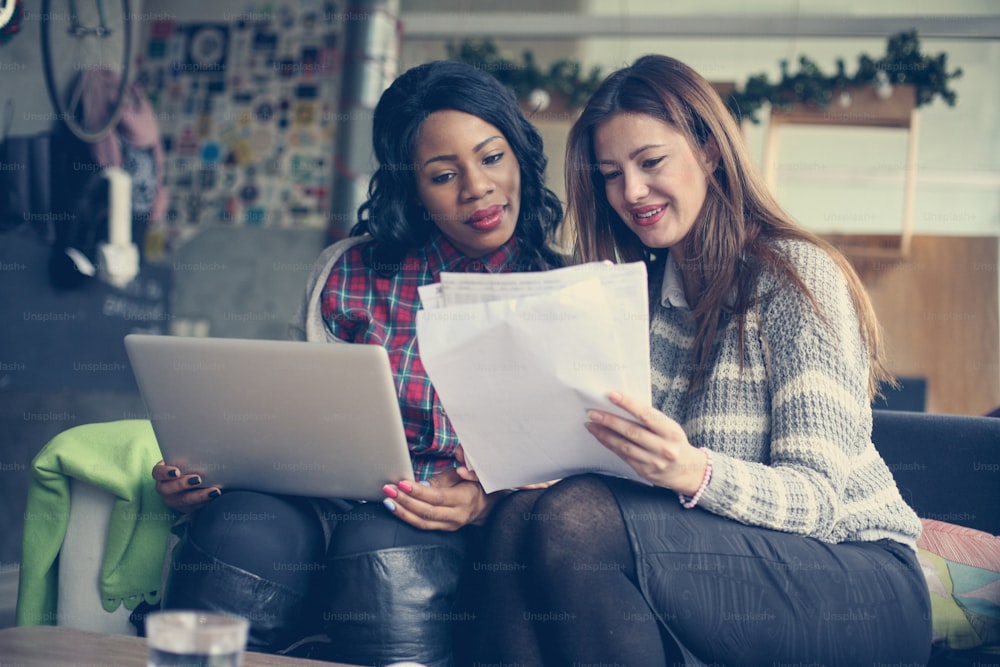 Young business women reading document.