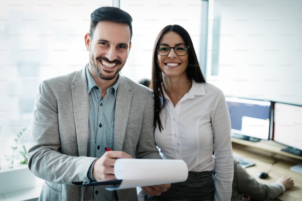 Professional business colleagues working in modern office