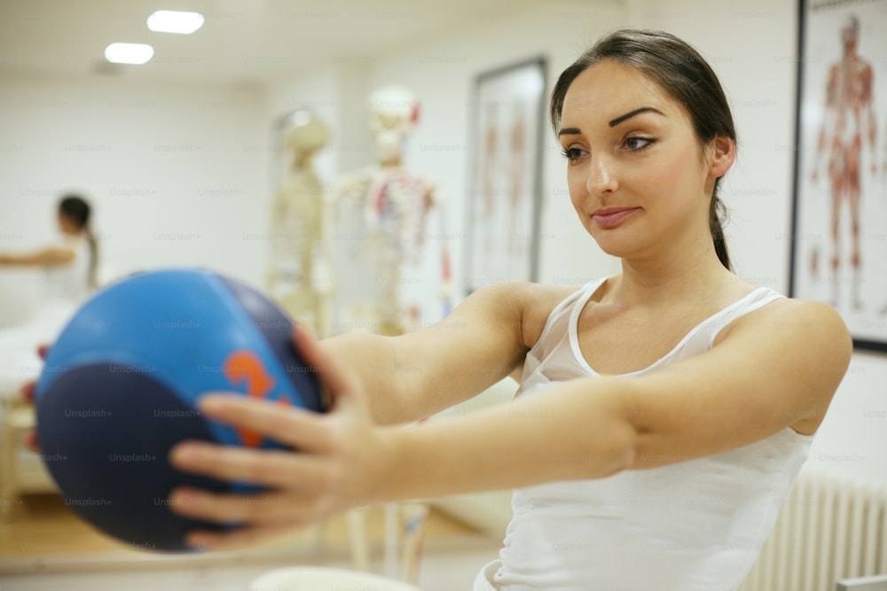 Brunette woman on physical therapy.