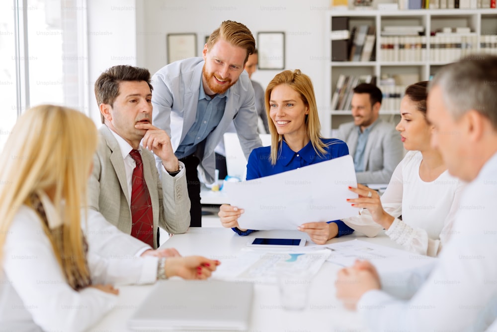 Business people working in office and brainstorming