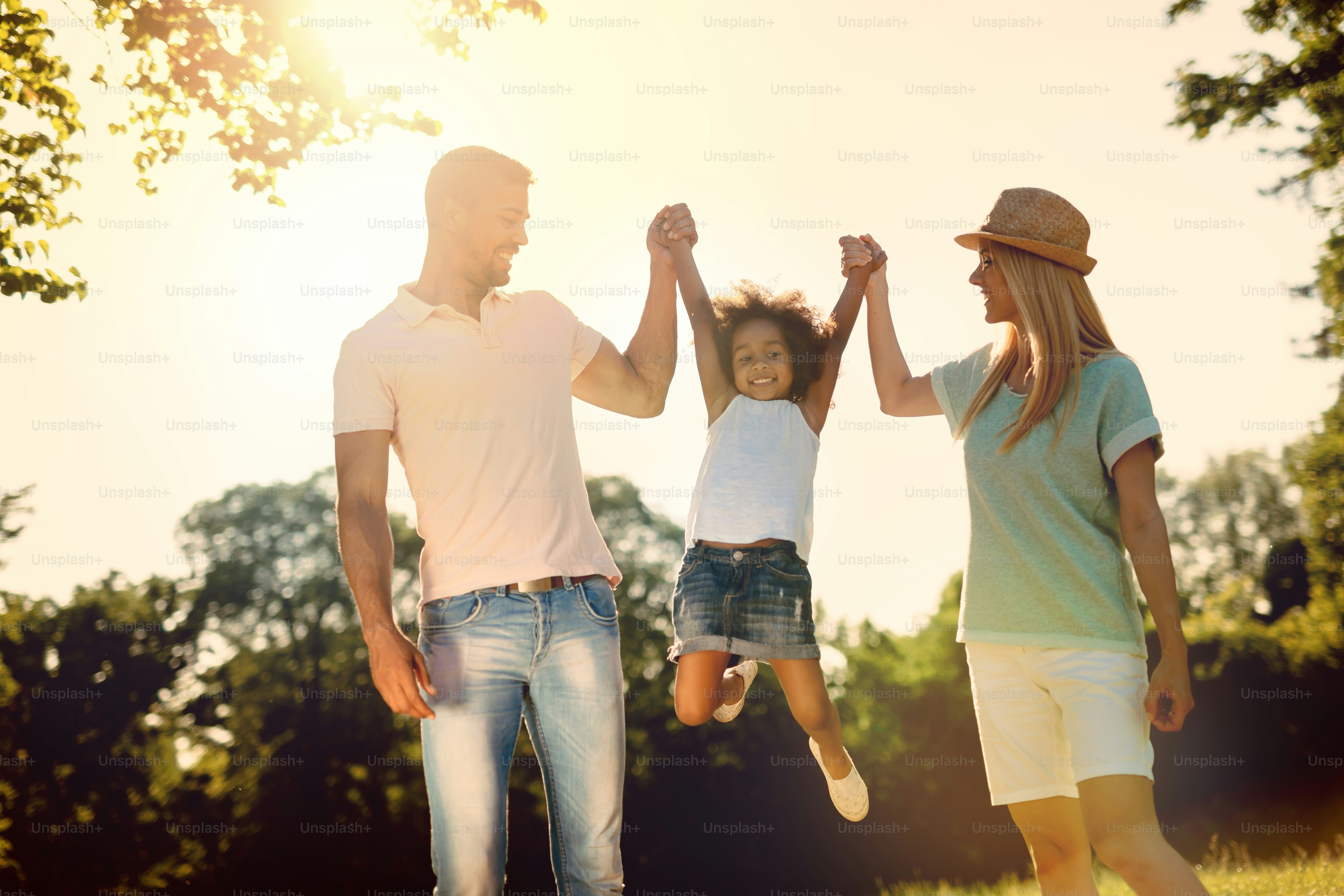 Playful family having fun outdoors and walking