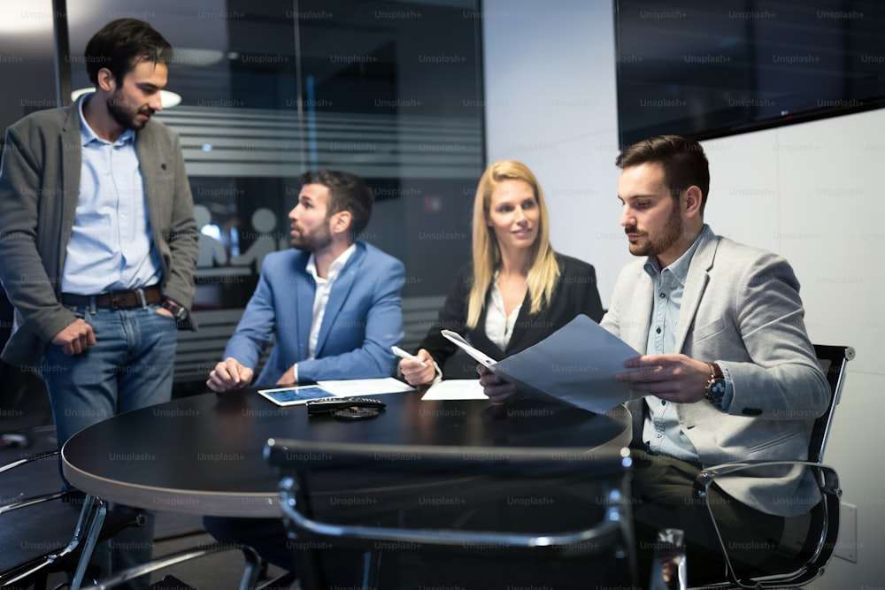 Business people working together on project and brainstorming in office