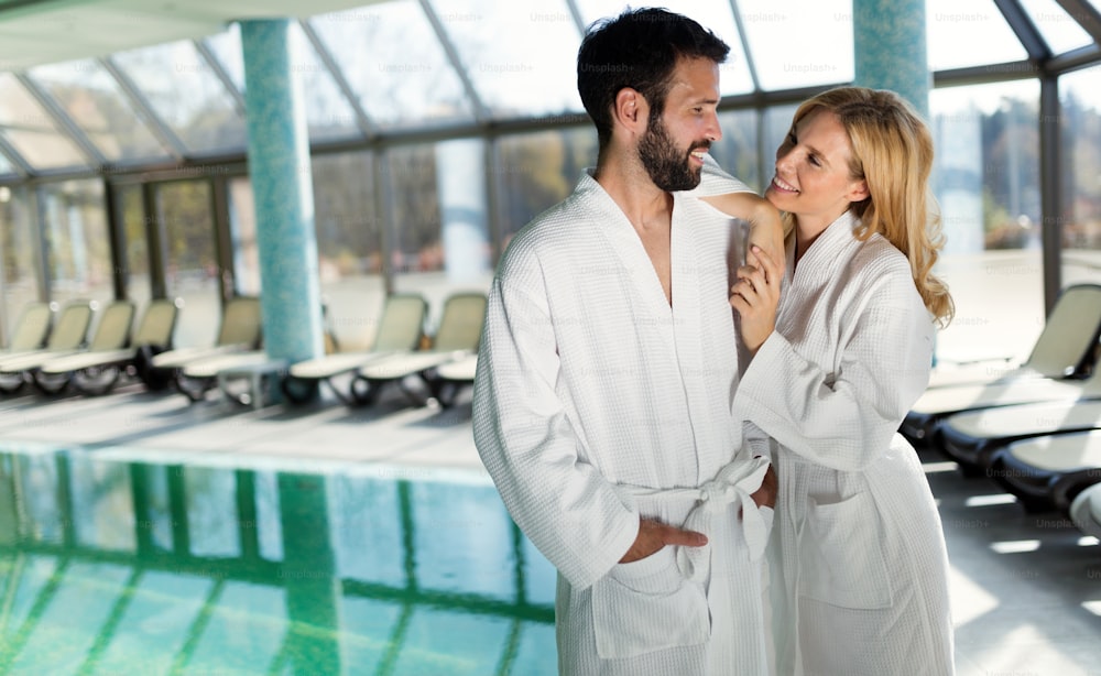 Happy coupleenjoying treatments and relaxing at wellness spa center
