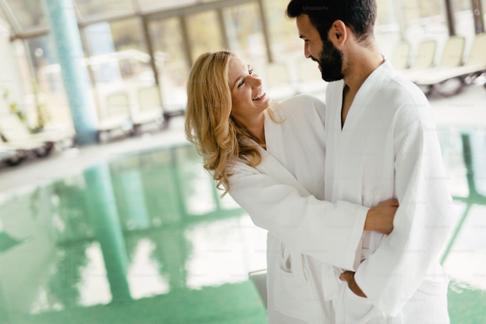 Happy coupleenjoying treatments and relaxing at wellness spa center