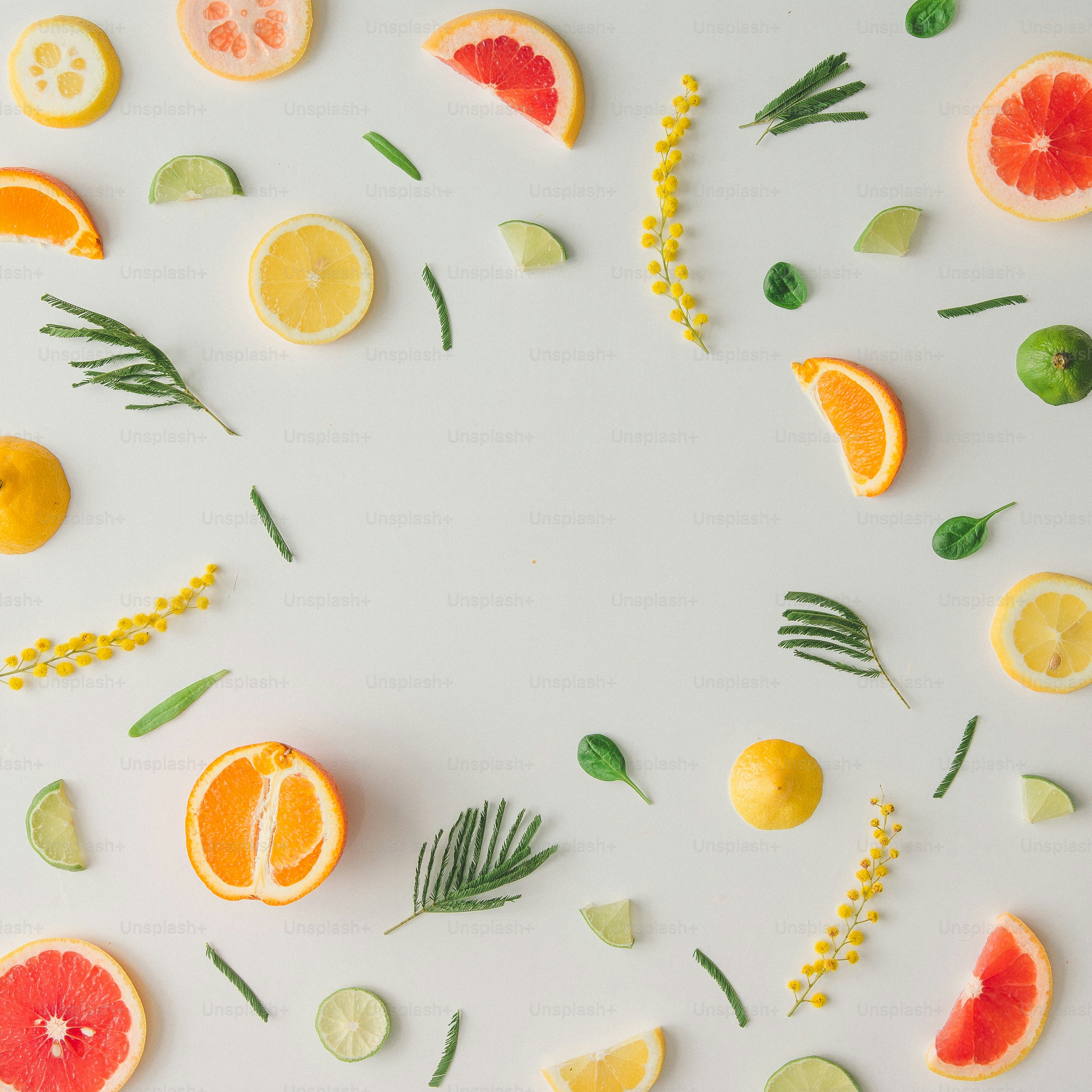 Colorful food pattern made of lemon, orange, grapefruit and flowers ...