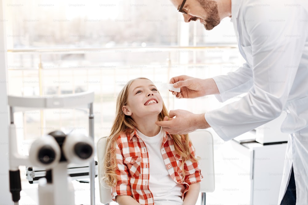 Professional assistance. Learned nice excellent ophthalmologist prescribing special medicine and assisting his little patient while giving her treatment