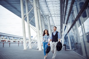 Two happy people at the airport Terminal