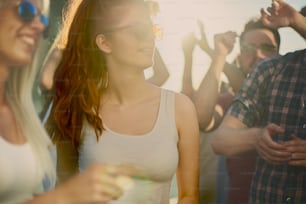 Big group of people dancing and having a good time at music festival