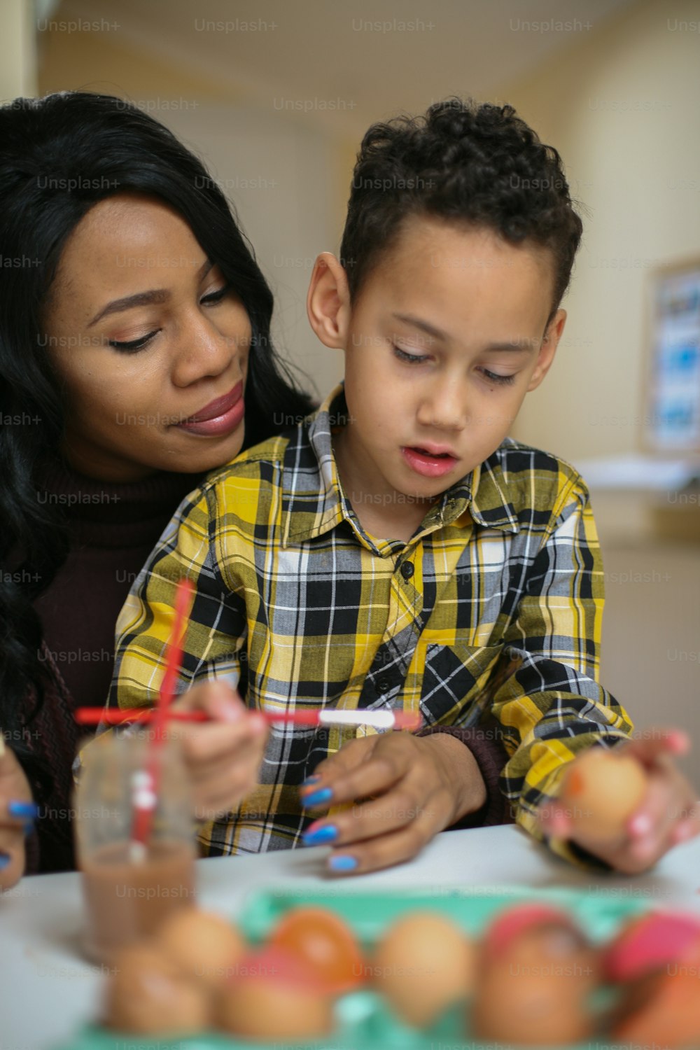 African American woman with her son. African American woman with her son prepare for Easter