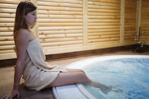 Woman enjoying hot tub relaxation at spa resort