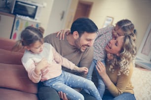 Portrait of family having fun in the living room.