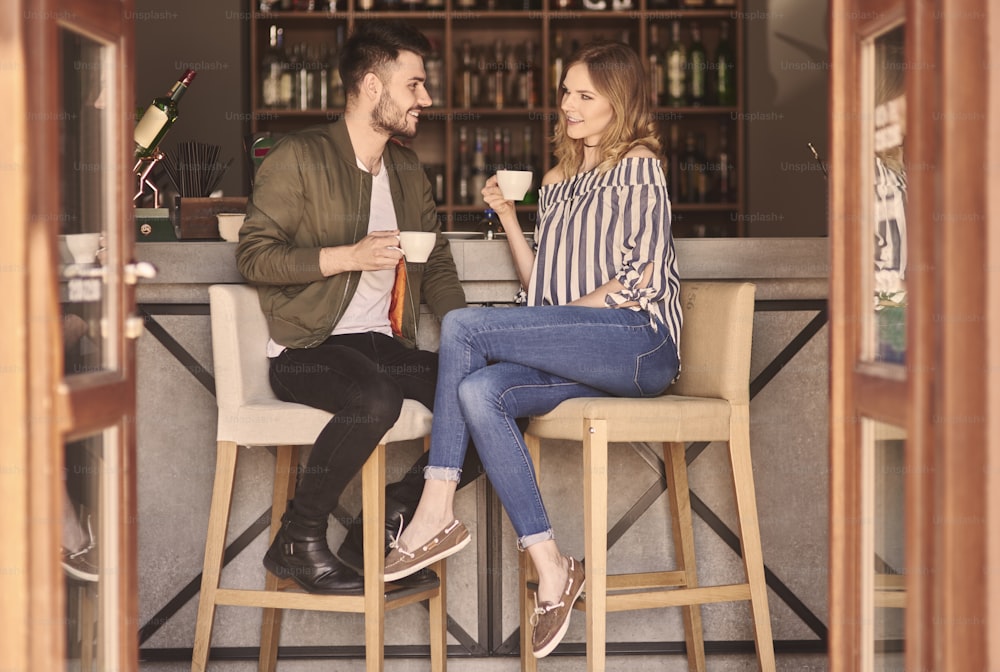 Full length of couple at bar counter